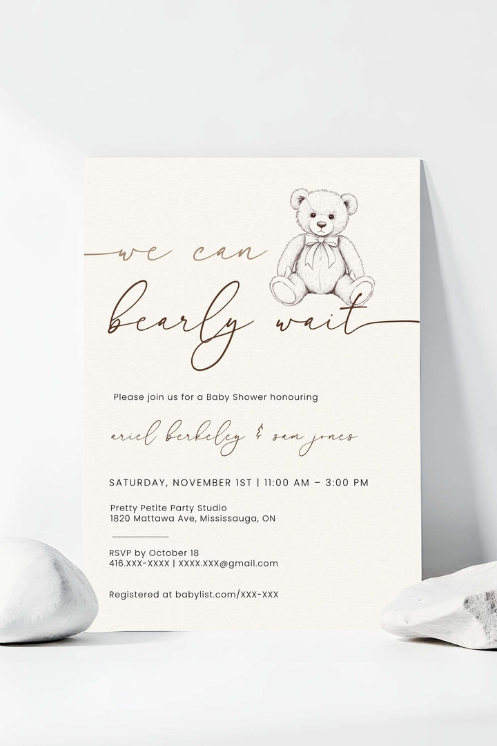 Baby shower invitation with teddy bear graphic and text on a white background