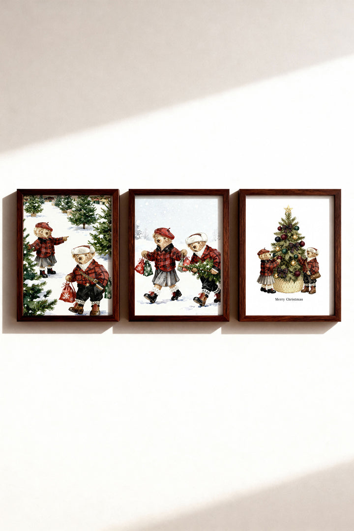 Set of three framed Christmas-themed prints on a wall.